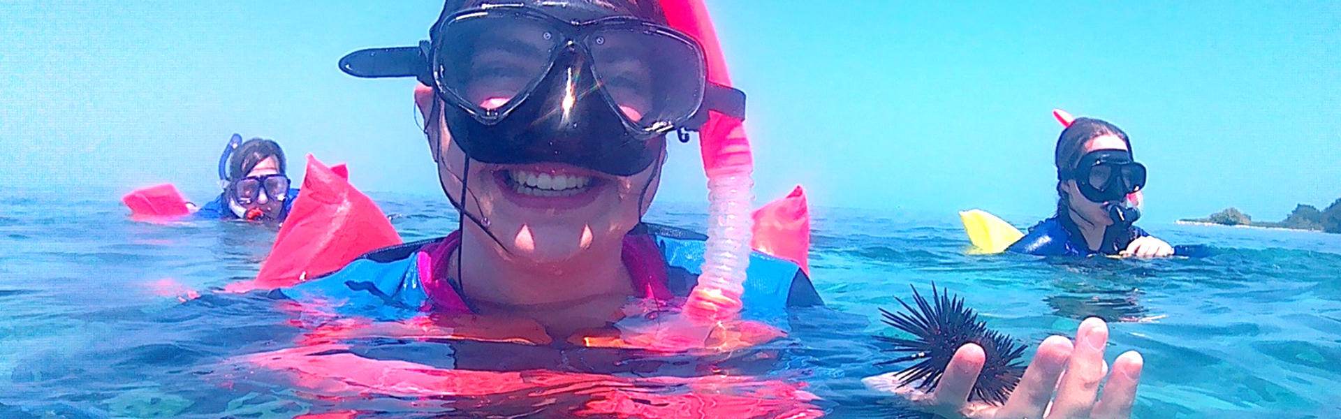 student snorkeling in Belize
