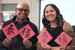 Venkatraman Gopalan and Angela Cleri take part in a Lunar New Year Celebration