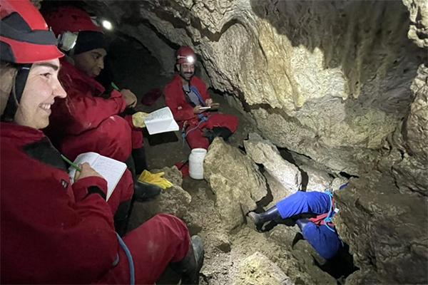 Students move through Italy's Frasassi Cave System