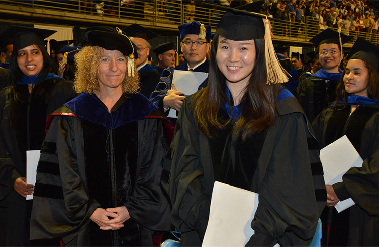 Professor and student at graduation