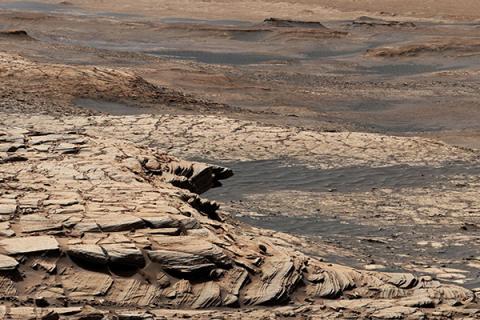 Stitched together from 28 images, this view from NASA's Curiosity Mars rover was captured after the rover ascended the steep slope of a geologic feature called "Greenheugh Pediment." 